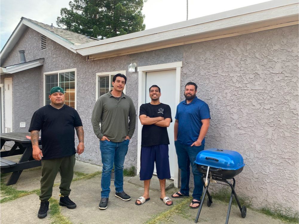 men-in-front-of-home