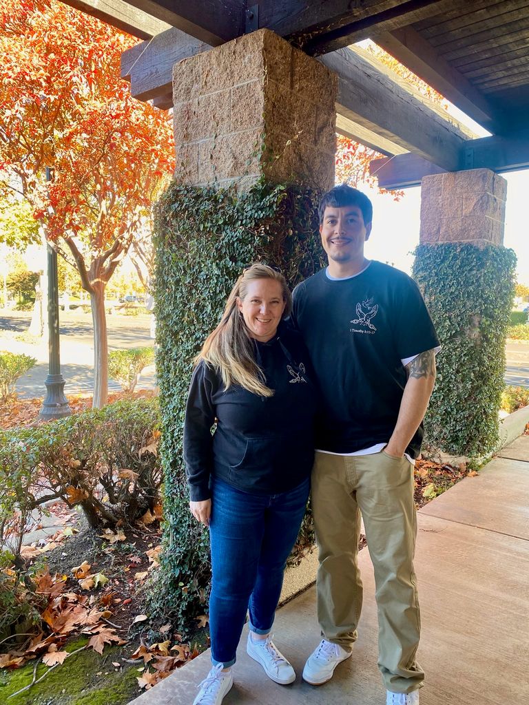 woman-man-standing-in-front-of-office