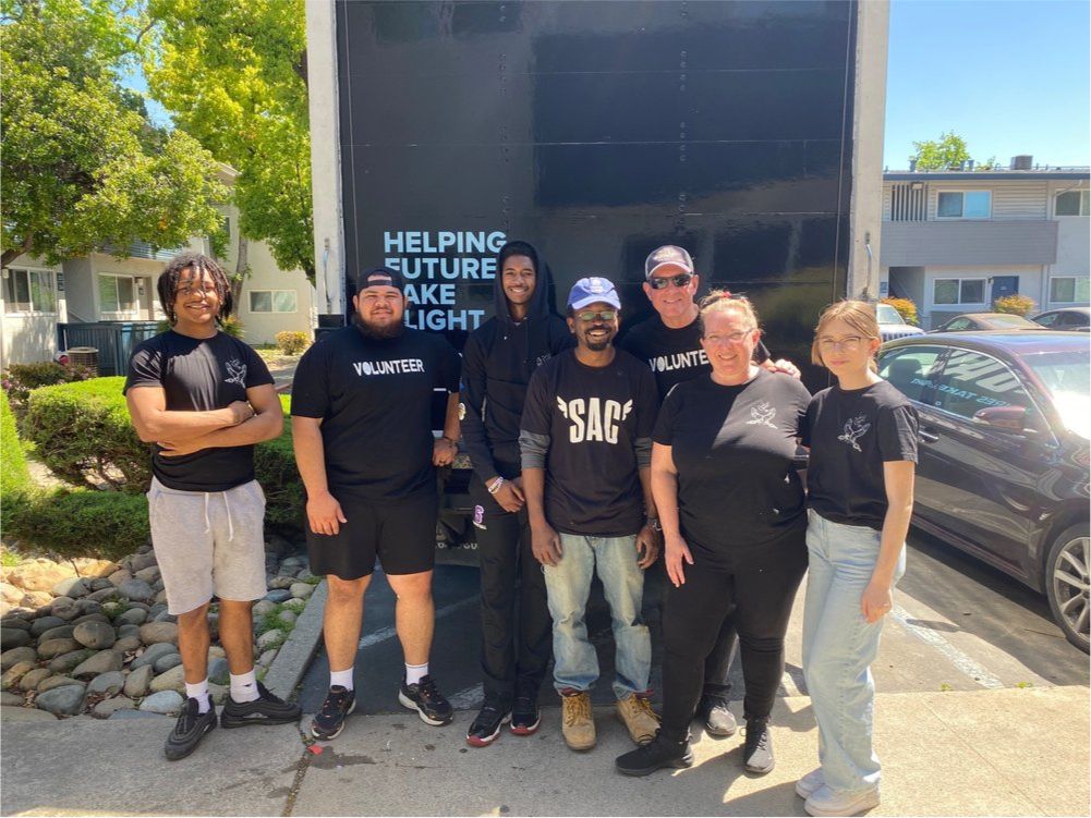 volunteer-posing-in-front-of-truck